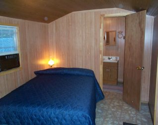 Camp Inn Cabin Rentals with covered porch on the Nantahala River